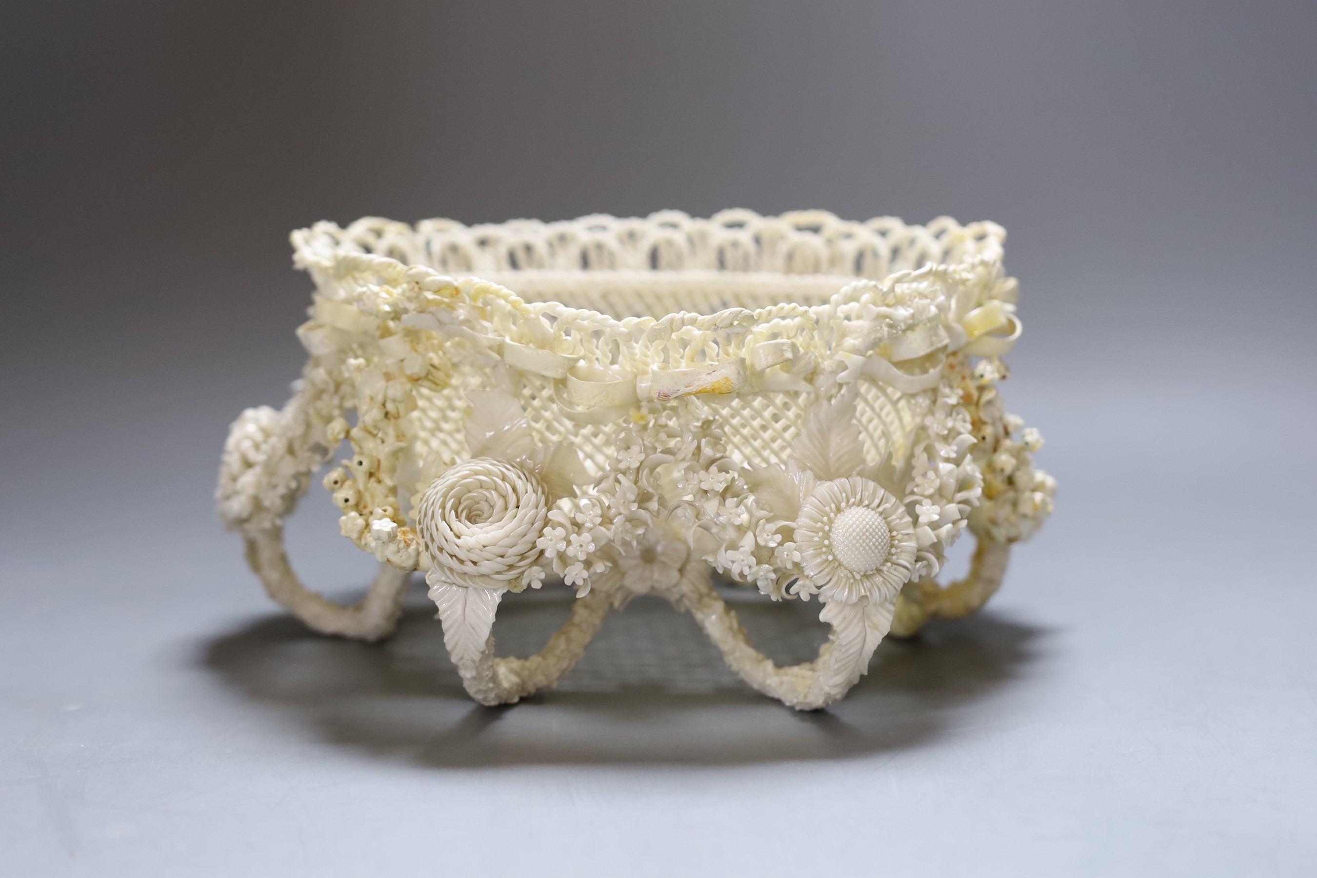 A Belleek floral encrusted basket (restored), 24cm